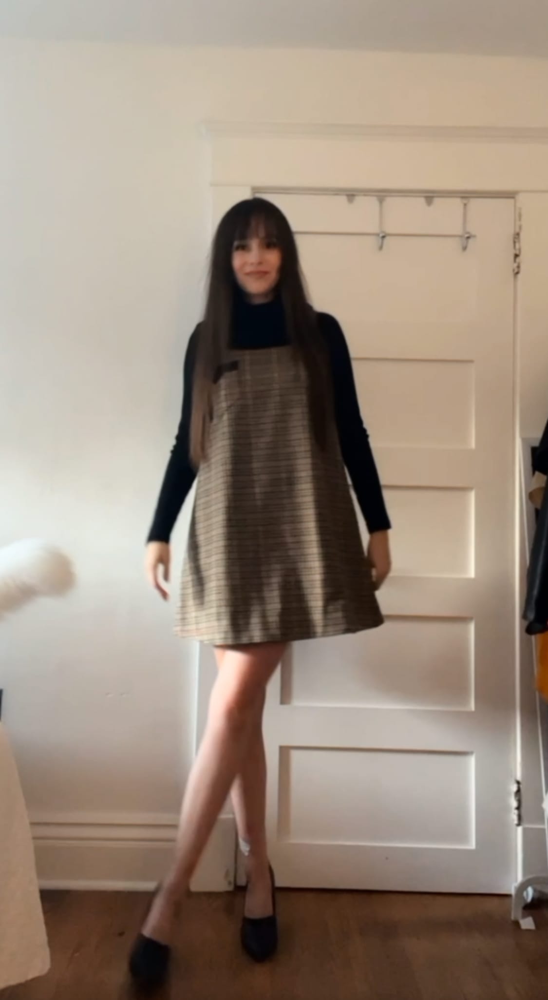 Alex Bailey wearing a prada houndstooth shift dress